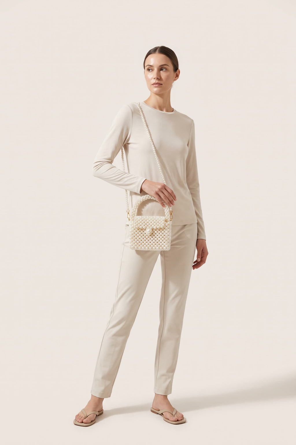 Iris mini bag in ivory — on model