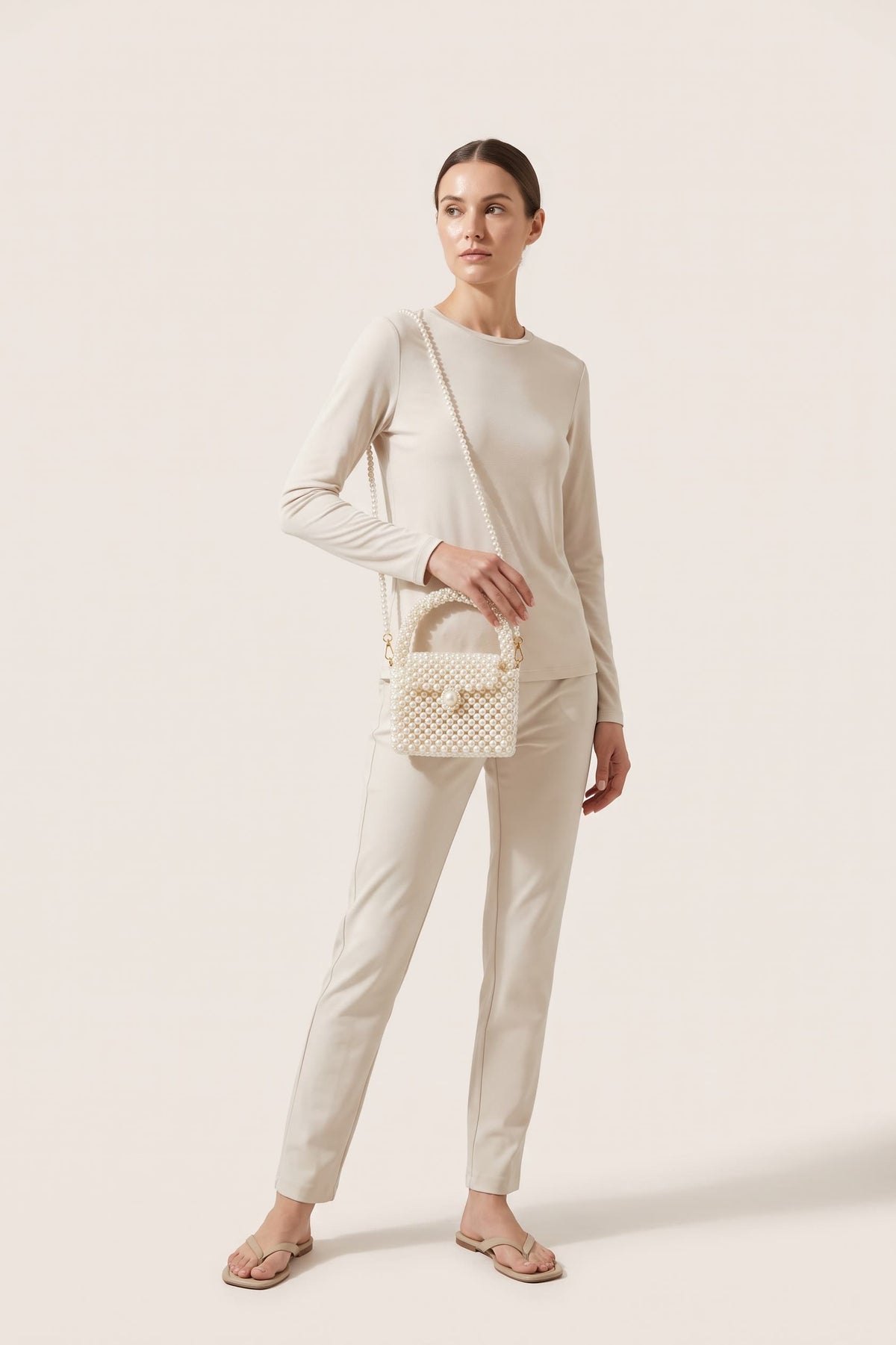 Iris mini bag in ivory — on model