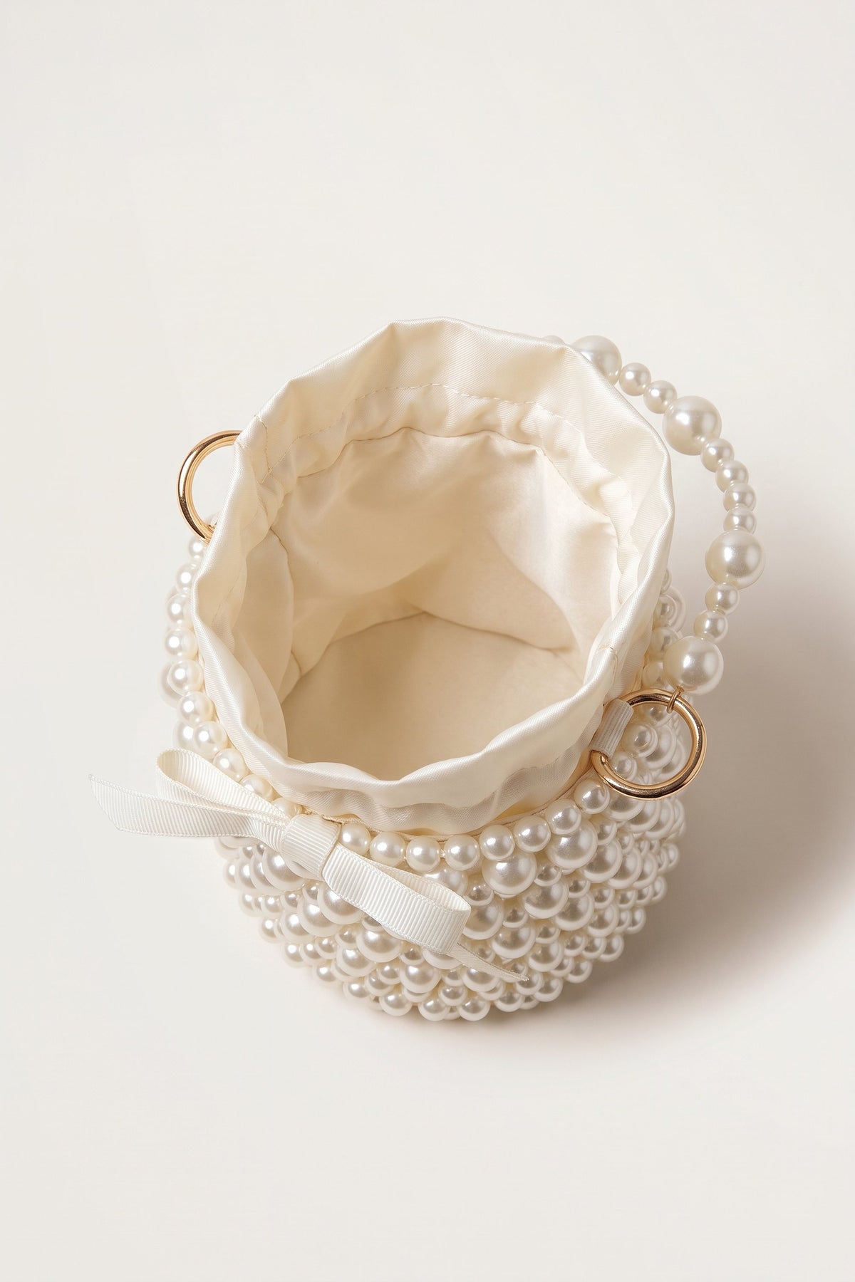 Isla faux-pearl bucket bag in ivory — open view