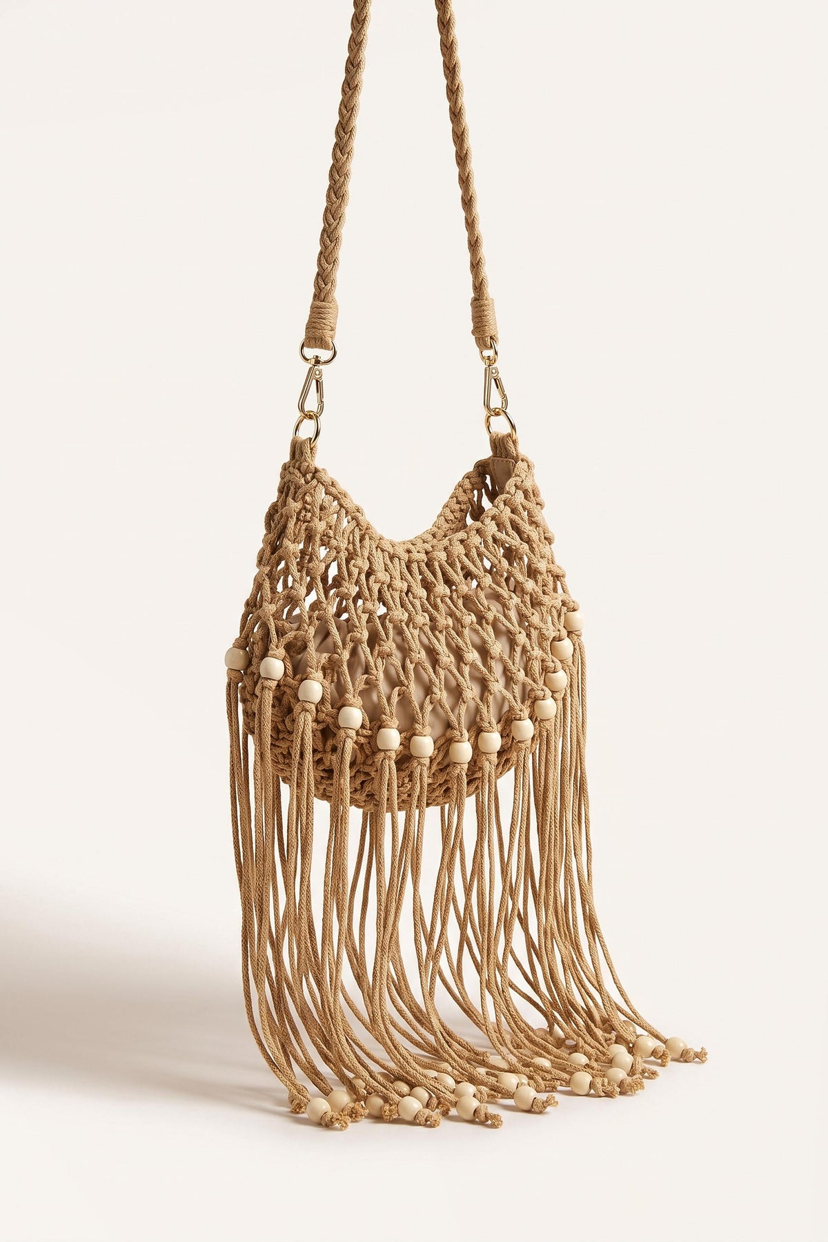 Juniper Shoulder Bag in Beige — three-quarter view