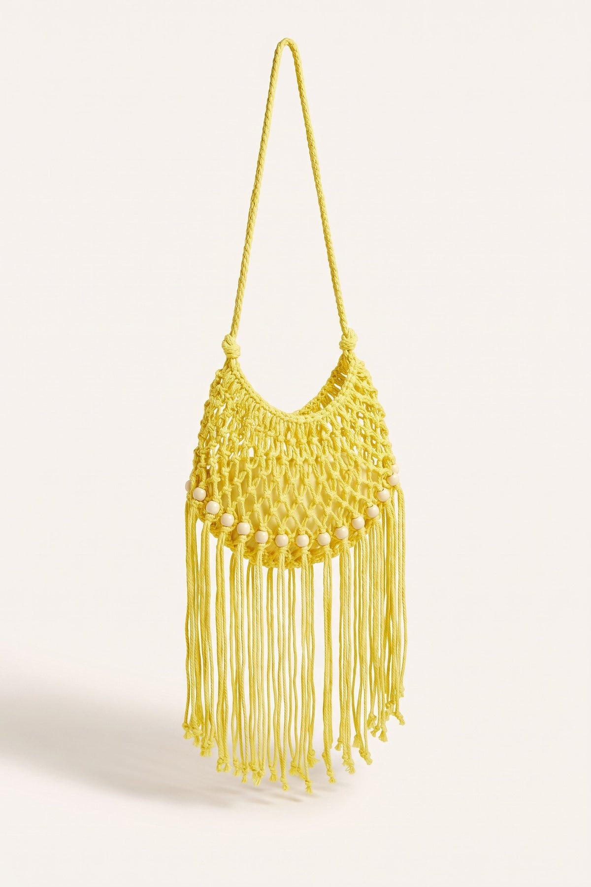 Juniper Shoulder Bag in Yellow — three-quarter view