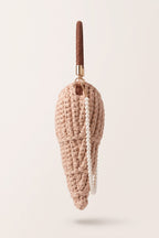 Lucille woven handbag in beige — side view