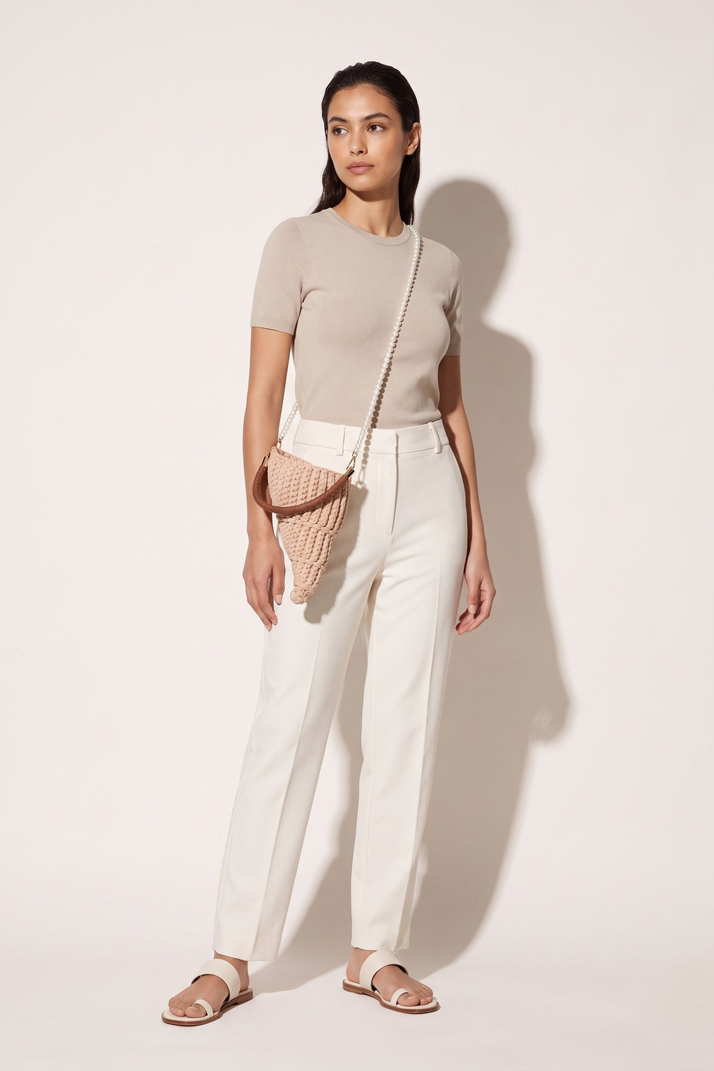 Lucille woven handbag in beige — on model