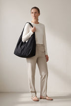 Luna tote bag in black — on model