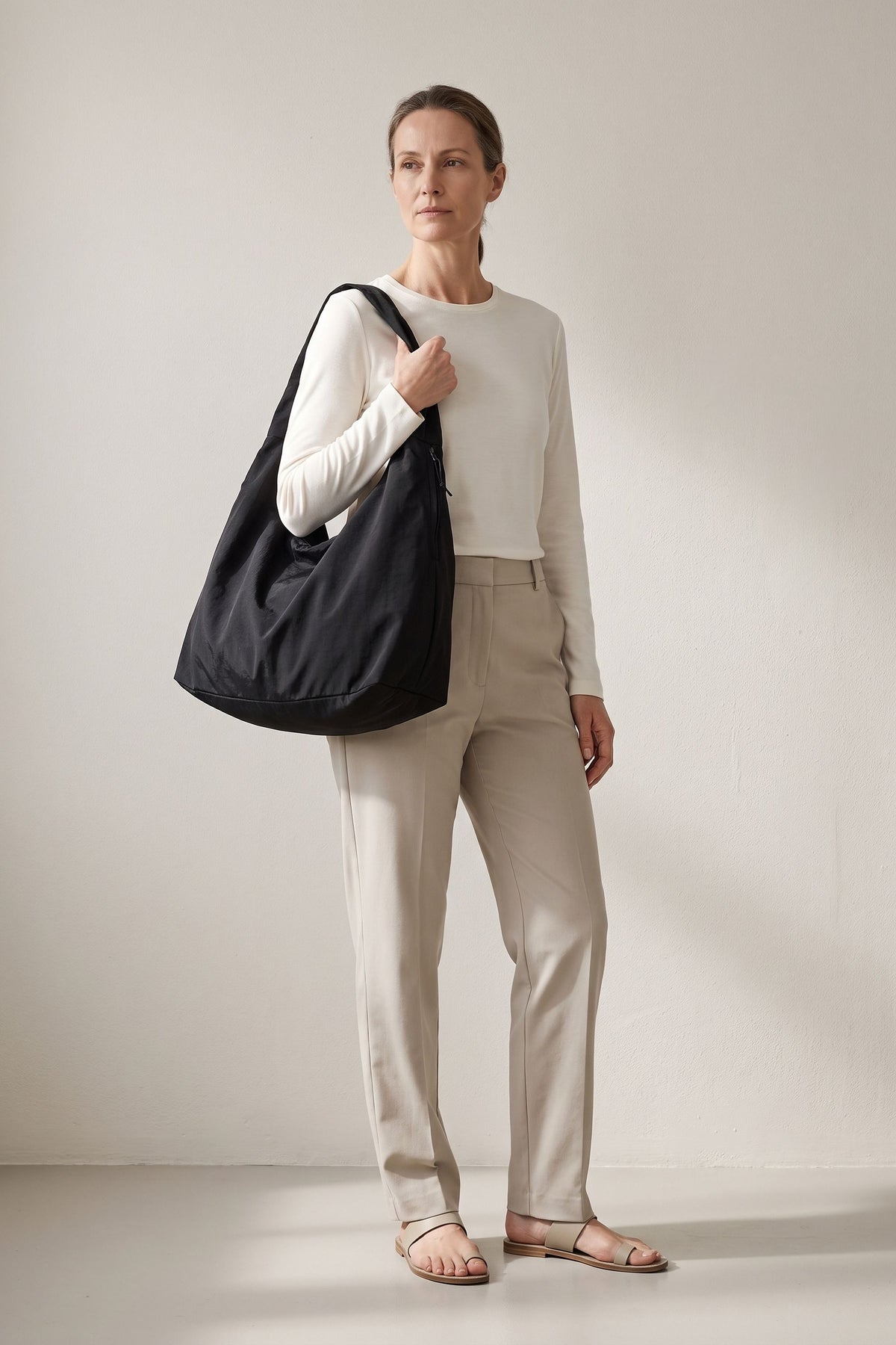 Luna tote bag in black — on model