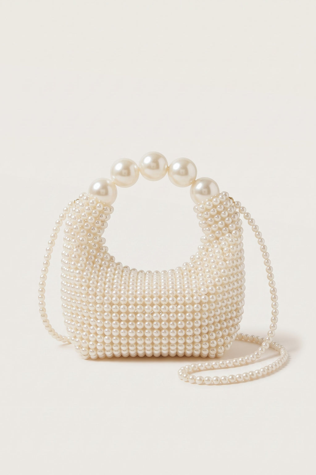 Odette faux-pearl handbag in ivory — side view