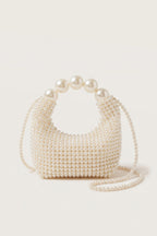 Odette faux-pearl handbag in ivory — side view