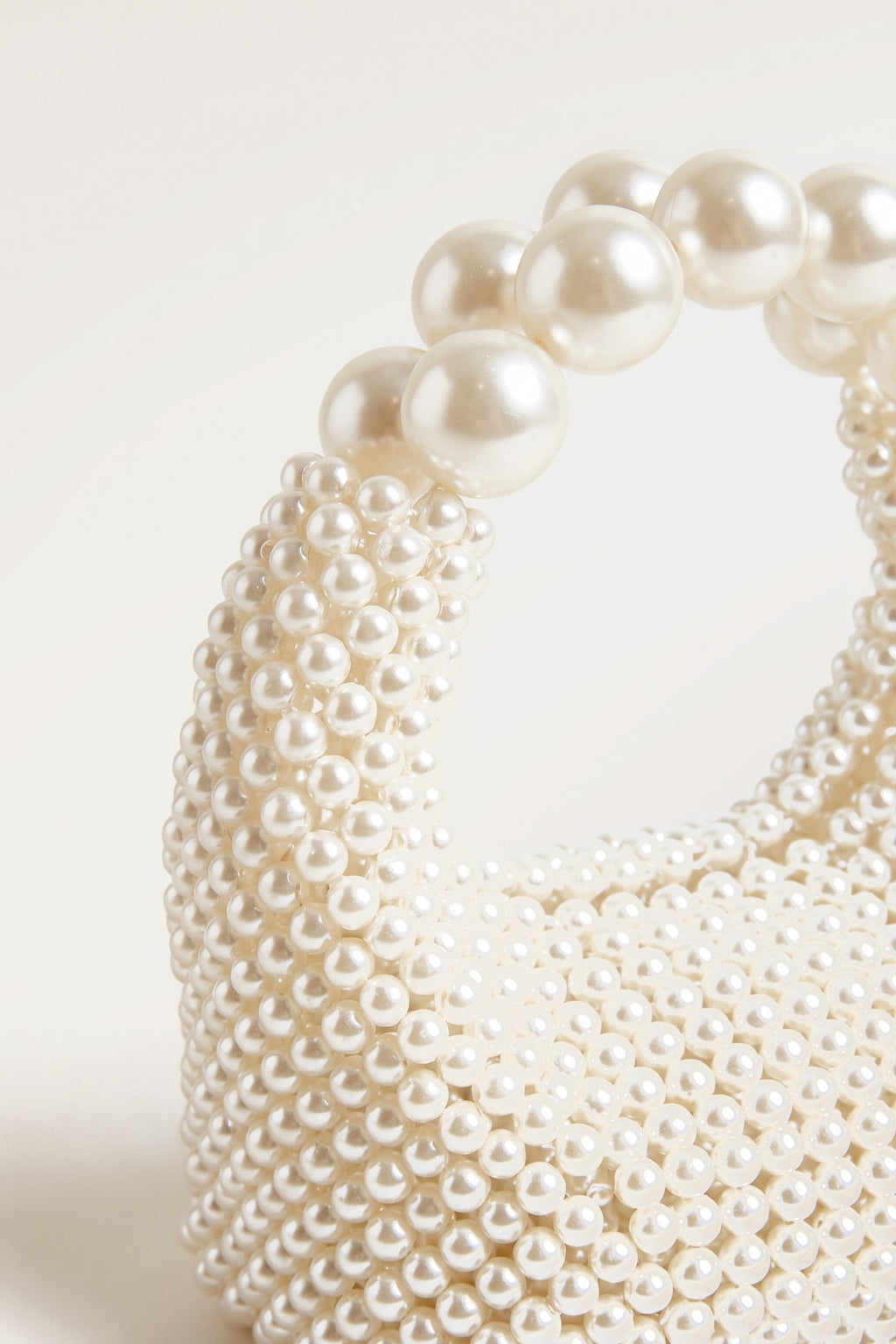 Odette faux-pearl handbag in ivory — detail