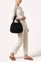 Ottilie tote bag in black — on model