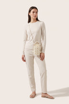 Perla crossbody bag in ivory — on model