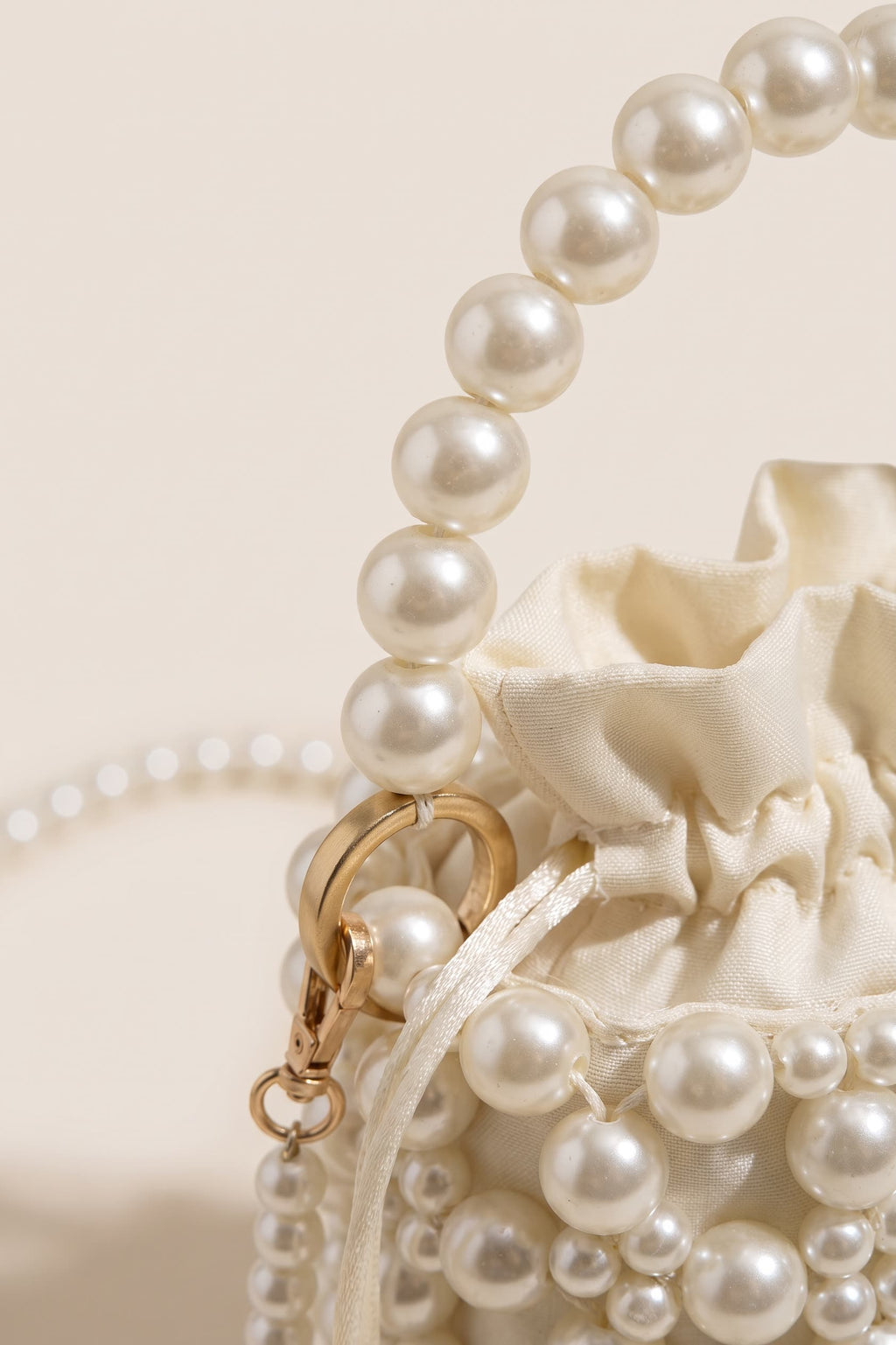 Perla crossbody bag in ivory — detail
