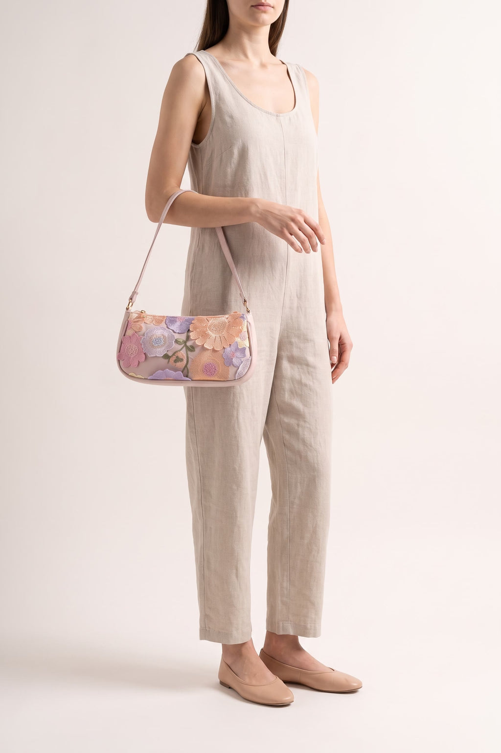 Primrose pastel floral embroidery shoulder bag in pink — on model