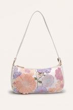 Primrose pastel floral embroidery shoulder bag in white — front view