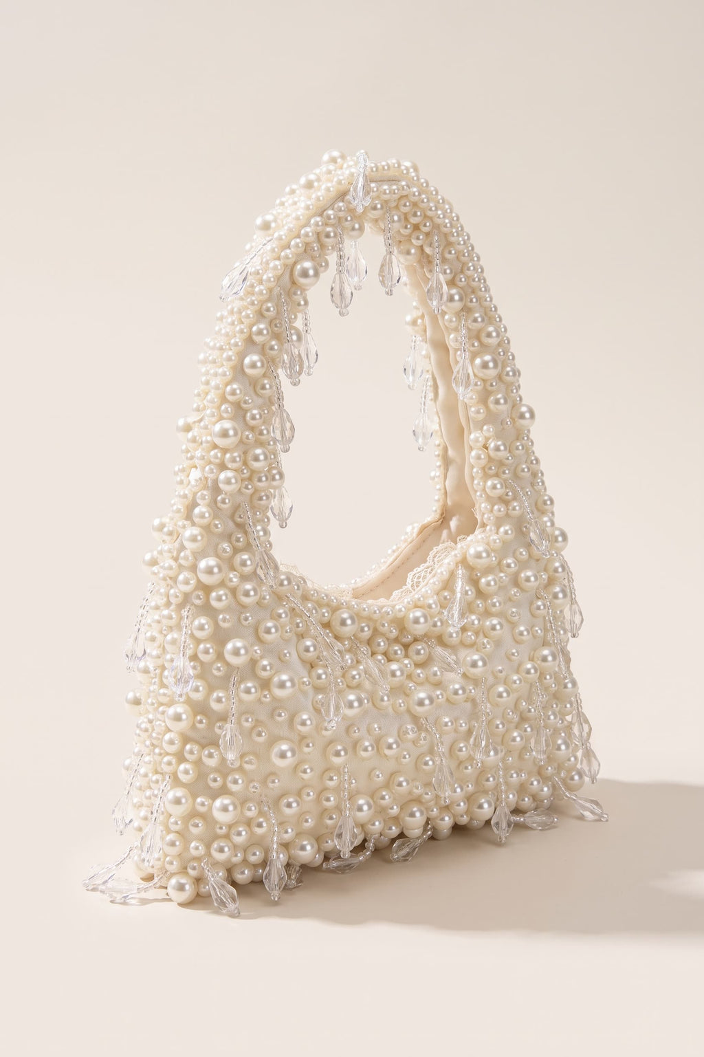 Vivienne handbag in ivory — three-quarter view