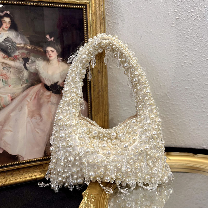 Vivienne vintage-style faux-pearl handbag in ivory — styled