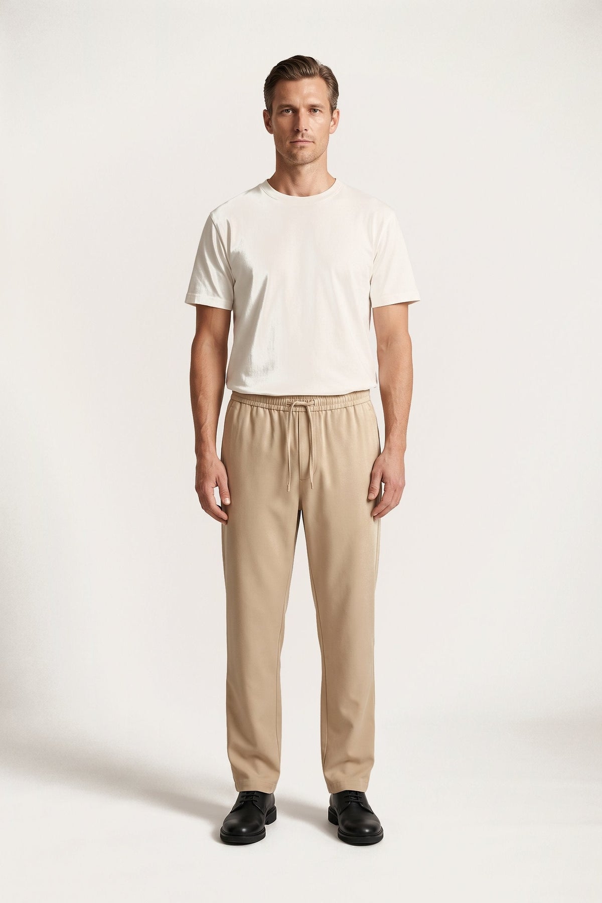 Alve trousers in sand — front view