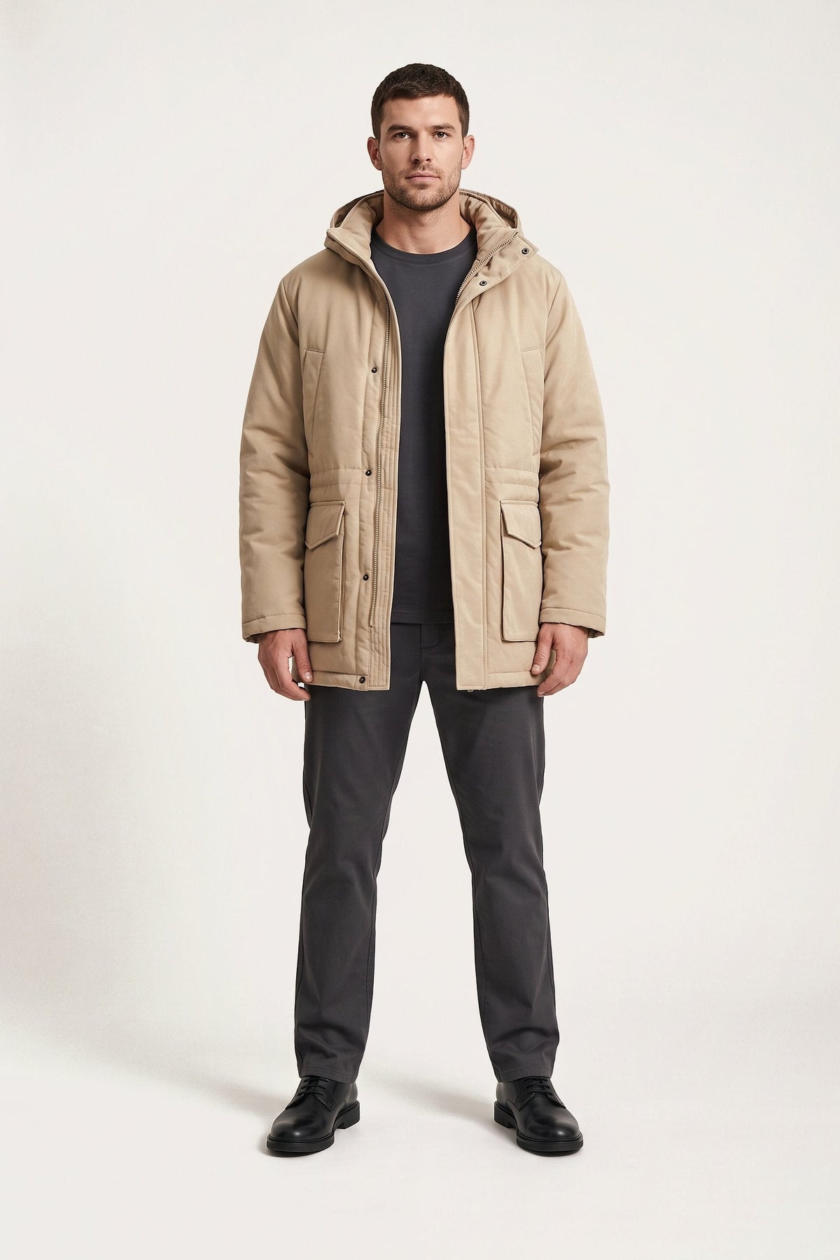 Gustav parka in sand — front view on model