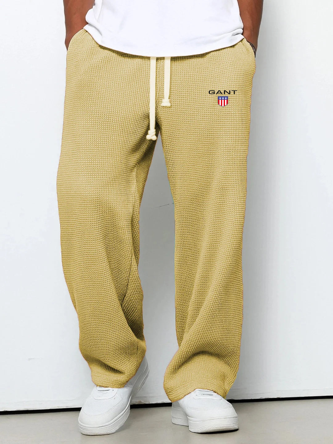 GANT® waffle-knit trousers in yellow — front view on model