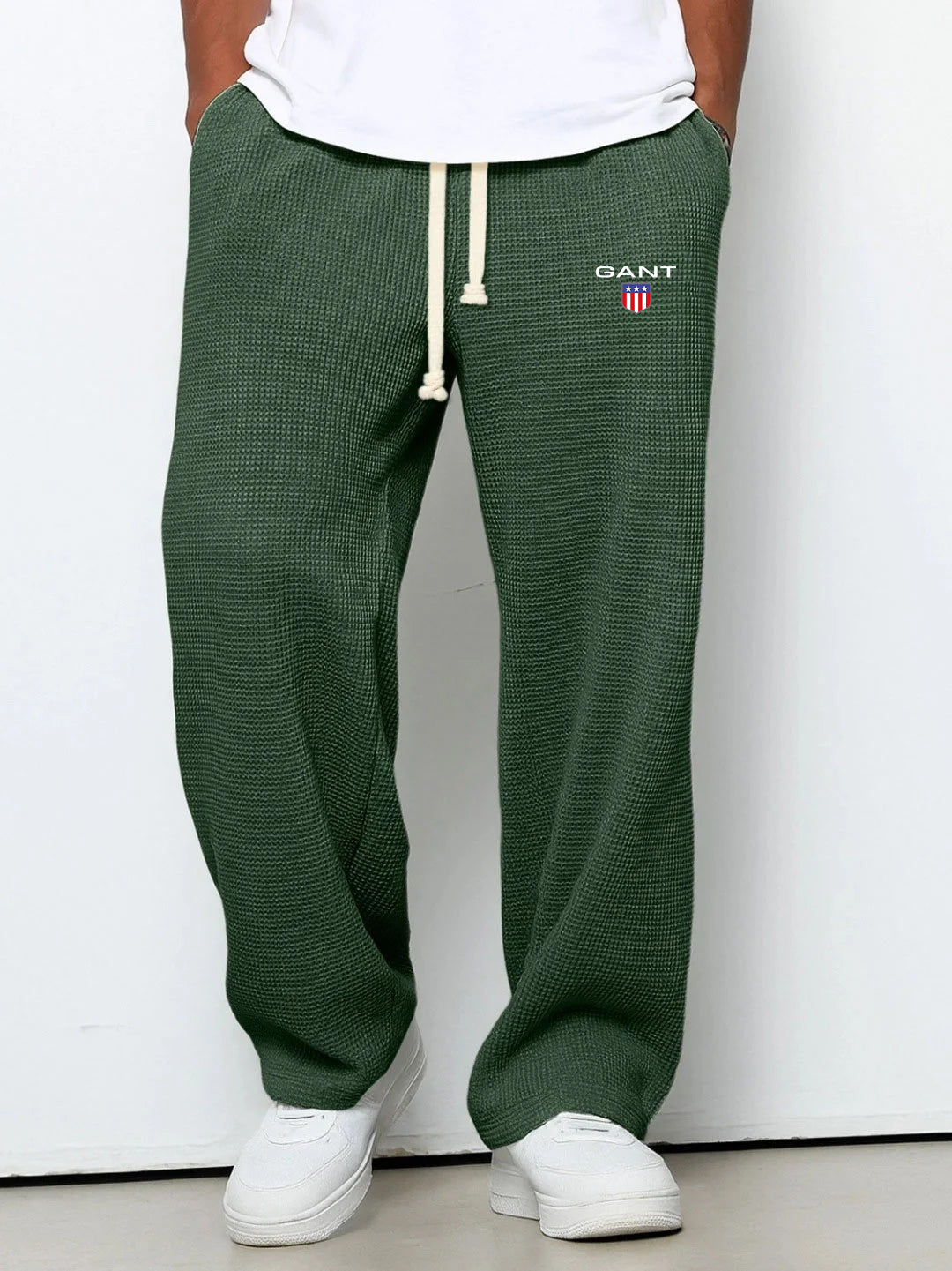 GANT® waffle-knit trousers in dark green — front view on model