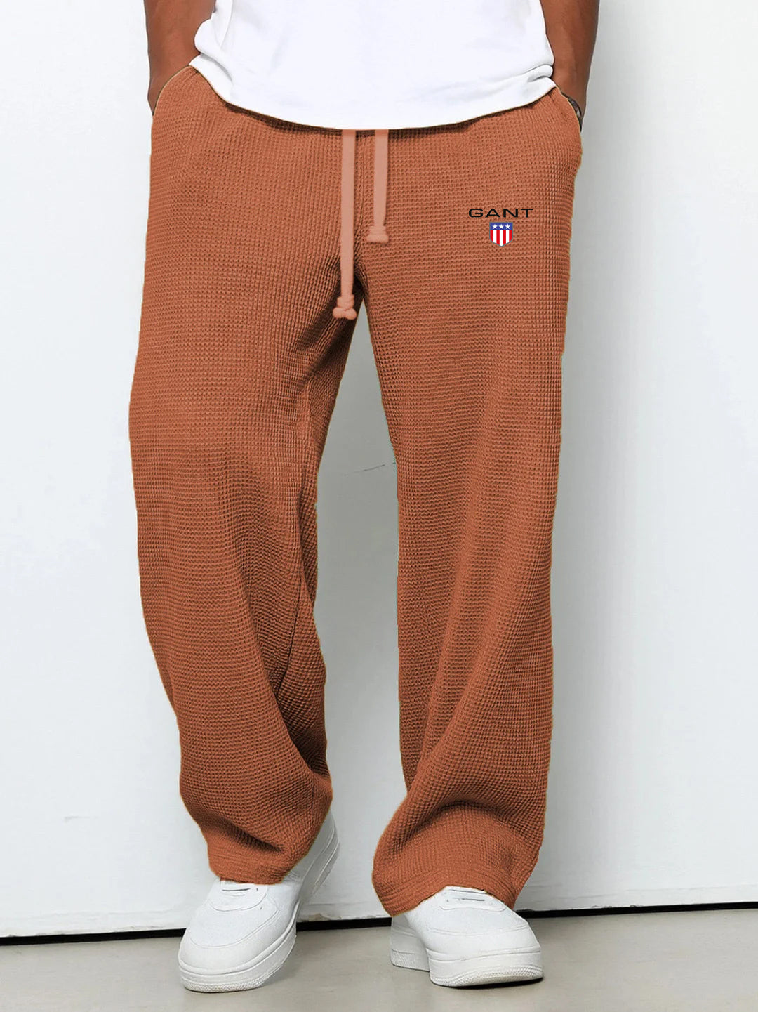 GANT® waffle-knit trousers in light green — front view on model
