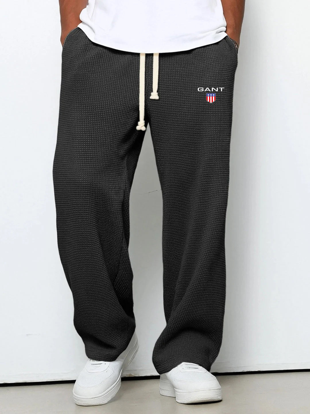 GANT® waffle-knit trousers in black — front view on model