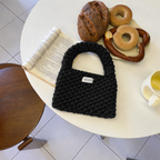 Wren crochet mini tote bag in black — styled