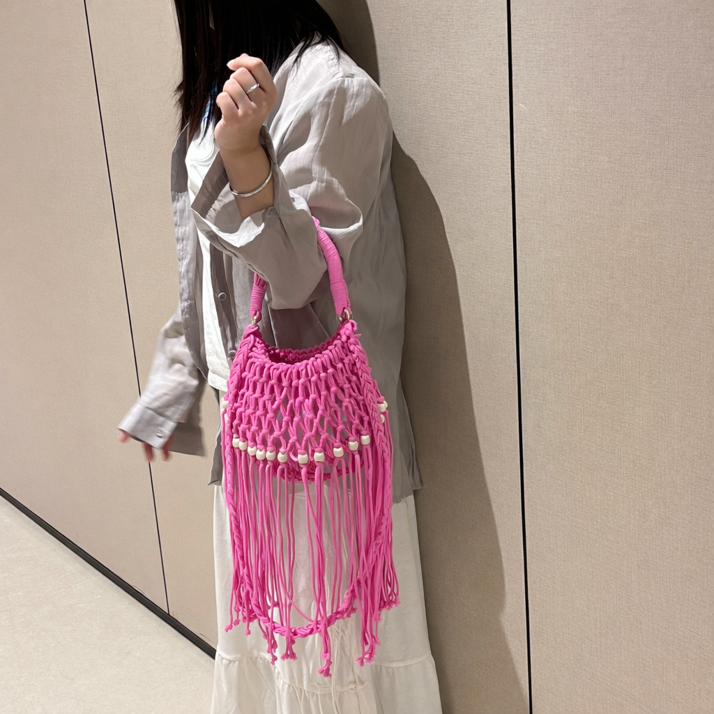 Juniper fringe crochet bag in pink — on model