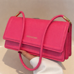 Harriet minimalist structured shoulder bag in pink — on model