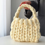 Ottilie woven tote bag in light yellow — three-quarter view
