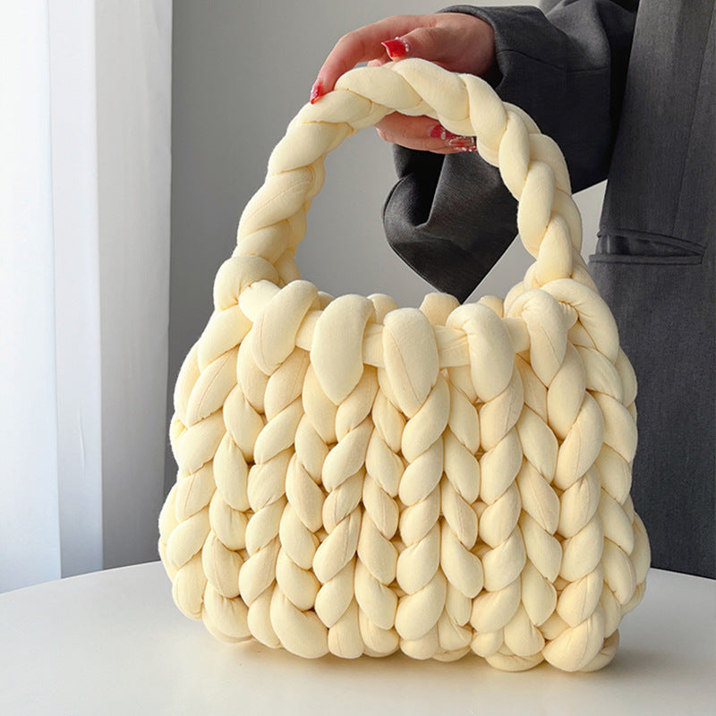 Ottilie woven tote bag in light yellow — three-quarter view